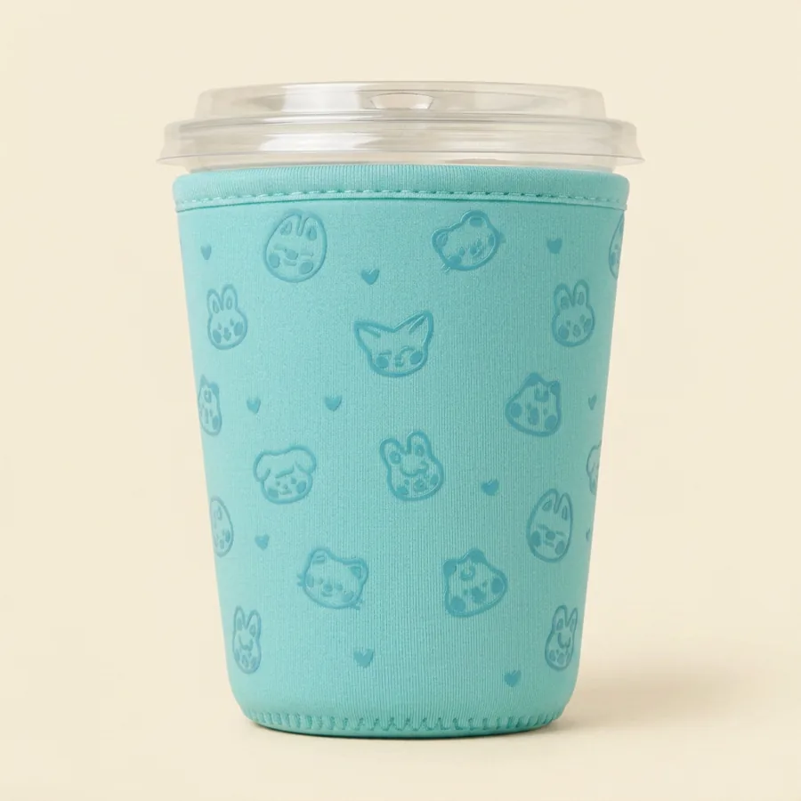 Teal sleeve printed with a tonal pattern of animal faces and hearts